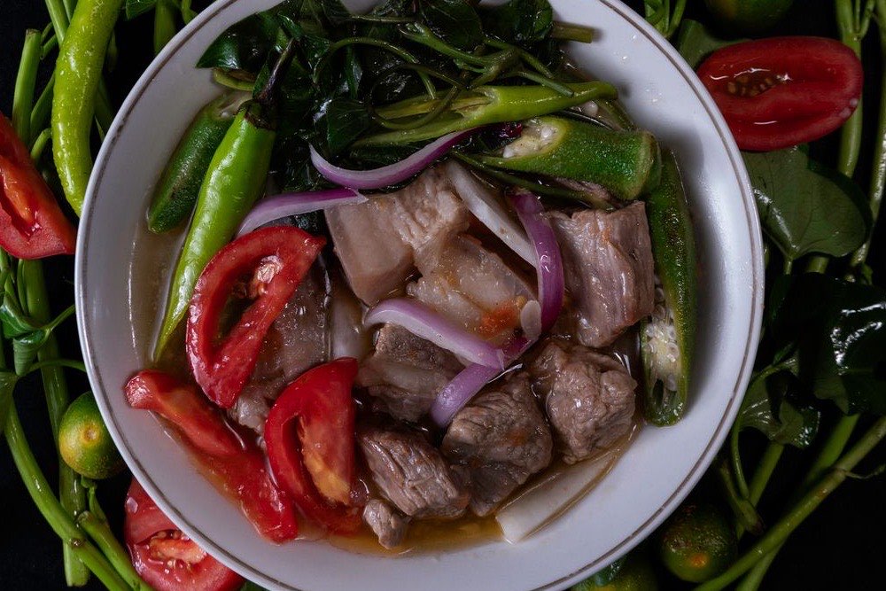 Filipino sinigang sour tamarind soup with pork and vegetables